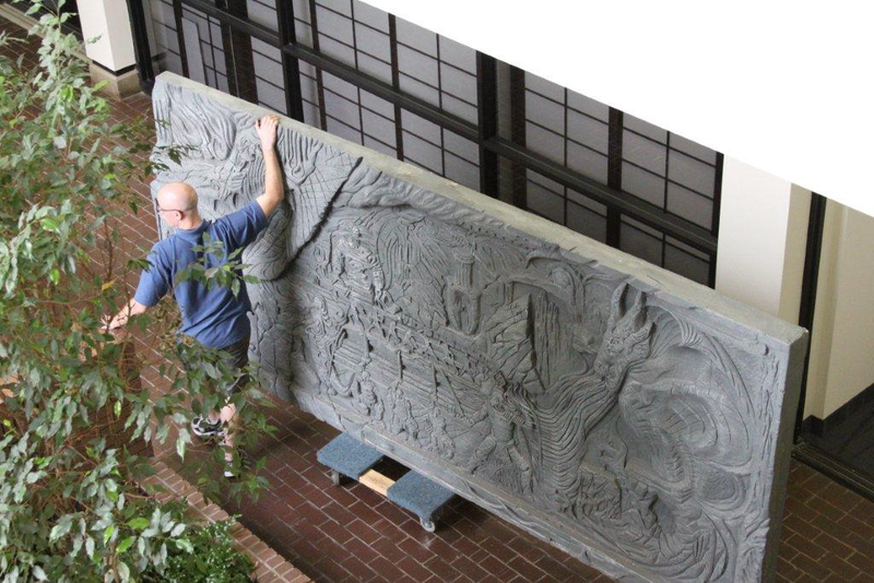 Illustration for article titled Skyrim's Giant Dragon Wall, Installed on a Regular Office Wall